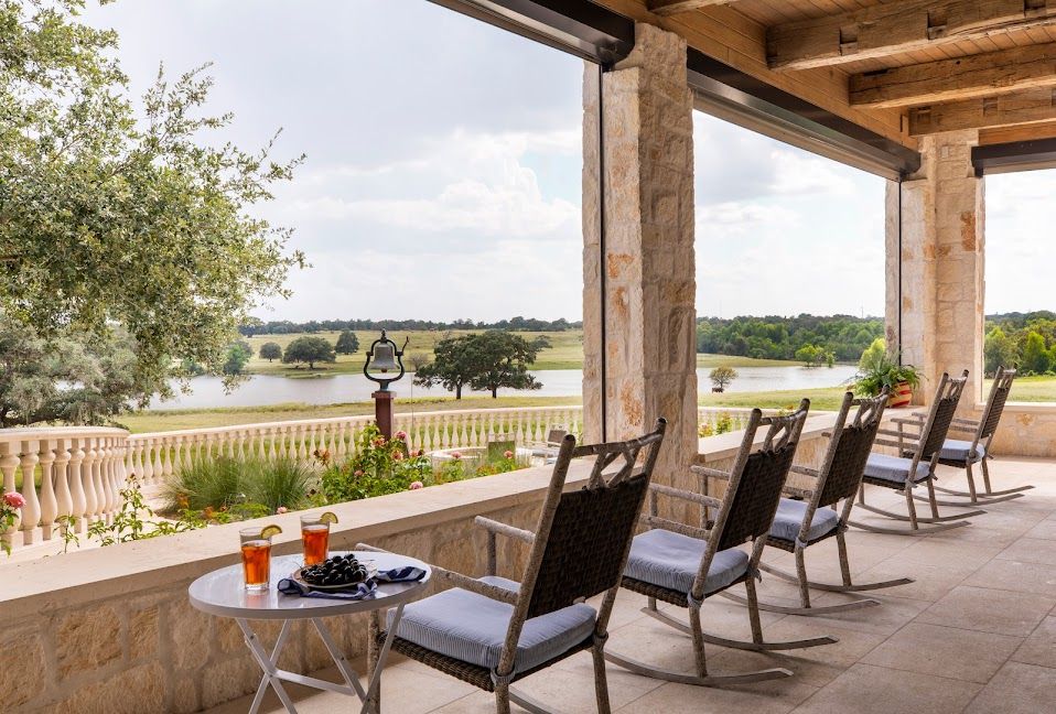 The porch with rocking chairs facing the lake